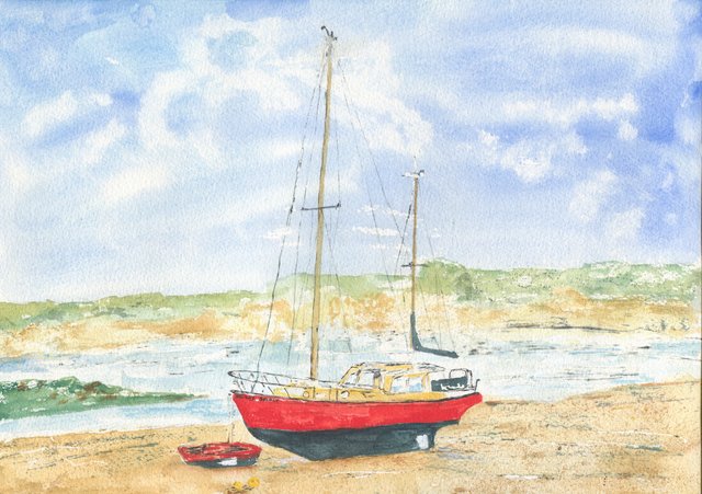 A red-hulled motor sailer named Holiday Spirit sits beached on the sand at low tide with a small red dinghy, under a cloudy blue sky.